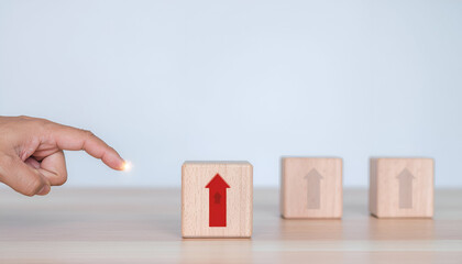 Leadership and breakthrough idea shown by one arrow crossing a barrier ahead of others.