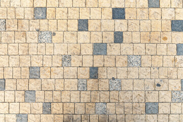abstract background of beige and grey tiles on the track in the park top view