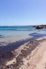 Rocks and water on the beach of San Silverio, Sardinia, Italy.