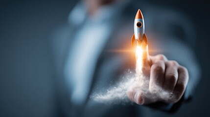 Business person launches a rocket with a finger, representing innovation and progress in a corporate environment