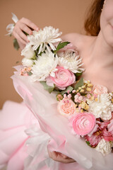 photo session of a girl in a bouquet of fresh flowers