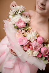photo session of a girl in a bouquet of fresh flowers
