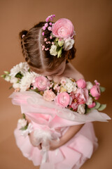 photo session of a girl in a bouquet of fresh flowers