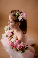 photo session of a girl in a bouquet of fresh flowers