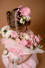 photo session of a girl in a bouquet of fresh flowers