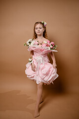 photo session of a girl in a bouquet of fresh flowers