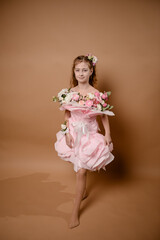 photo session of a girl in a bouquet of fresh flowers