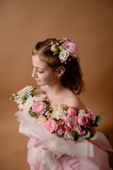 photo session of a girl in a bouquet of fresh flowers