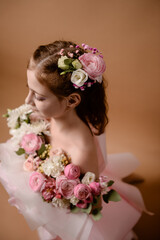 photo session of a girl in a bouquet of fresh flowers