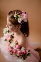 photo session of a girl in a bouquet of fresh flowers