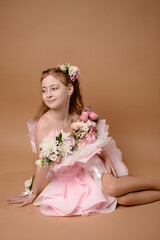 photo session of a girl in a bouquet of fresh flowers