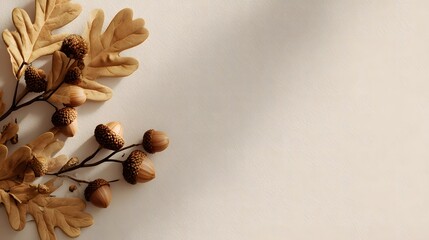 Minimal Autumn Background with Dry Oak Leaves and Acorns on Warm Beige Gradient with Copy Space