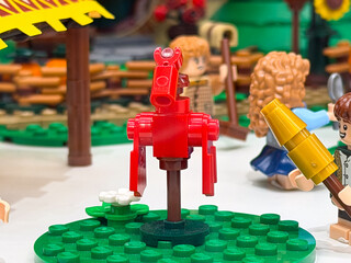 Fototapeta premium Colorful red horse figure in a playful scene