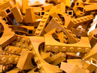 Fototapeta premium Pile of orange lego bricks for creative building