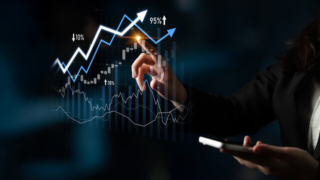A businesswoman interacts with growth graphs and statistics while holding a smartphone in a modern office setting, emphasizing financial analysis and market trends. Scalp - Powered by Adobe