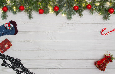 Christmas flat lay styled scene - frame with evergreen fir tree, decorations and present box
