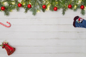 Christmas flat lay styled scene - frame with evergreen fir tree, decorations and present box