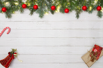 Christmas flat lay styled scene - frame with evergreen fir tree, decorations and present box