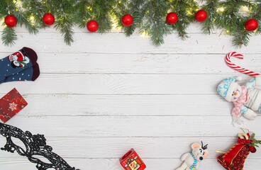 Christmas flat lay styled scene - frame with evergreen fir tree, decorations and present box