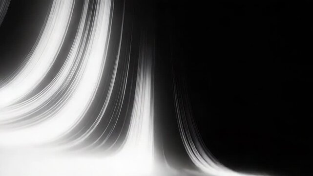 Abstract flowing light lines moving across dark space