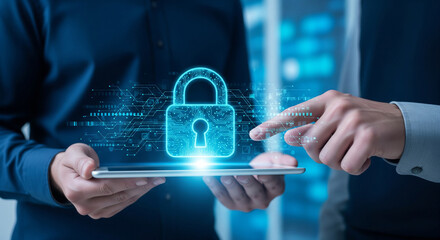 Person holding tablet with glowing padlock hologram for digital security.