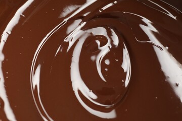 Tasty melted chocolate as background, closeup view