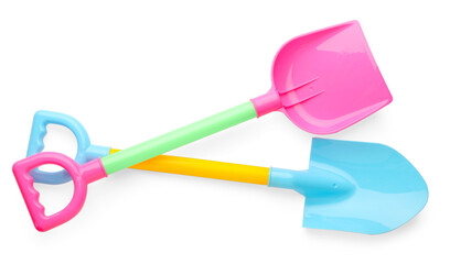 Bright plastic shovels isolated on white, top view. Children's beach toys
