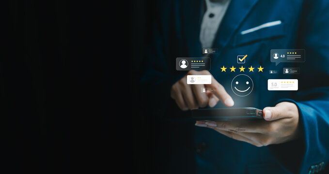 Customer satisfaction concept, businessman using smartphone with five star rating icons, positive feedback review, service quality, user experience, online reputation, trust loyalty.