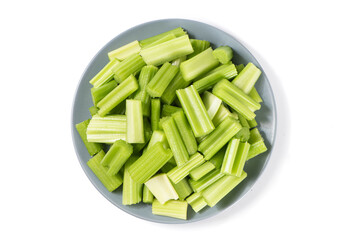 Fresh green cut celery isolated on white background