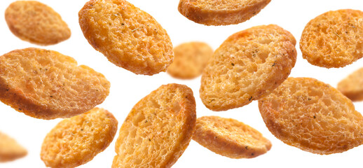 Bread croutons levitate on a white background