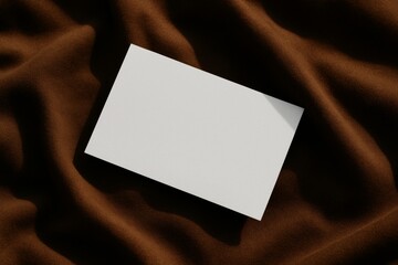 Blank white business card mockup on brown fabric background with soft shadows for branding or design template presentation purpose. Ai generative