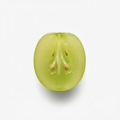 Bright green grape half with visible seeds on a clean white background