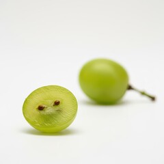 Bright green grape cut revealing its moist interior and small seeds