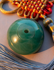 Green jade pendant with traditional Chinese knot ornament