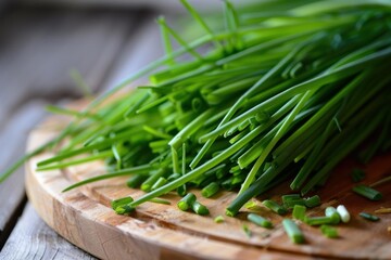 Fresh chives lie on a wooden cutting board, ready to add flavor to any culinary creation
