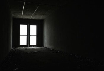 Figure in a Dimly Lit Passage Expressing Concepts of Anxiety and Fear