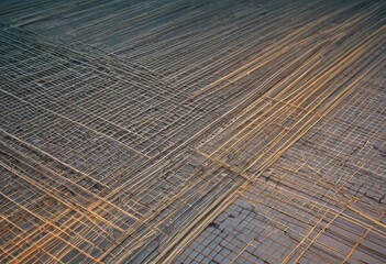Structural Pattern of Overlapping Rebar Illuminated by Evening Light