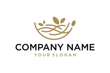 Elegant organic nest logo design with golden leaves symbol