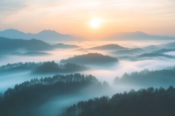 Fototapeta premium Misty mountain landscape at sunrise, foggy hills and trees under a vibrant sky with a bright sun.