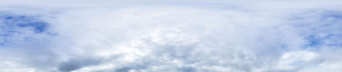 Blue sky panorama with cumulus clouds in seamless spherical equirectangular format as a full zenith for use in 3D graphics, games, and aerial drone photography for sky replacement.
