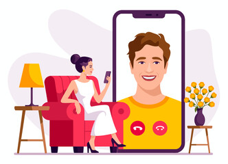 A woman relaxes on her couch, looking at a smartphone with a smiling face on the screen, showcasing connectivity and modern communication in daily life.