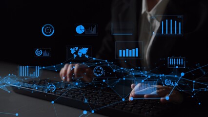 This image features hands interacting with a keyboard amidst vibrant digital data visualizations, representing modern business analysis and technology integration in a workspace. Xenic
