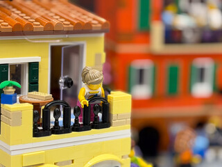 Fototapeta premium Colorful lego building with balcony and figure