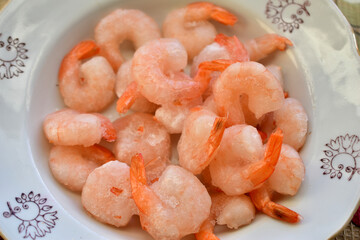 A plate of shrimp ready to cook. Top view.