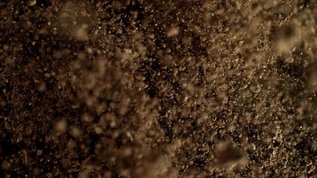 Super Slow Motion Shot of Exploding Soil Towards Camera at 1000fps.