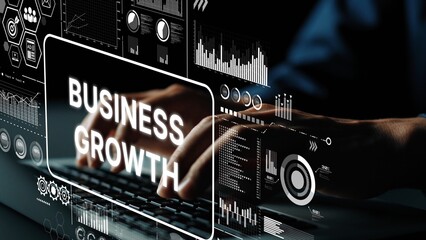 Hands Typing on Keyboard with Business Growth Graphics and Data Visualizations in a Modern Digital Workspace. Asymptotic smart data analytic.