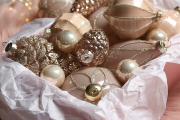 Collection of beautiful Christmas tree baubles in box, closeup