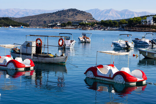 Ksamil, Albania - September 25, 2025: Pleasure boats anchored in the bay near Paradise Beach, Ksamil Albania, Mediterranean holiday resort scene