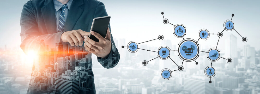 A businessman in formal attire interacts with a tablet, surrounded by digital icons that symbolize data networks against a city skyline, illustrating innovation and technology. Tessel - Powered by Adobe