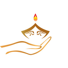Golden stylized hand gently holding an ornate traditional diya lamp with a glowing flame.